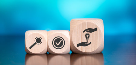 Wooden blocks with symbol of patent concept on blue backgroundの写真素材