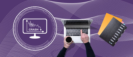 Top view of hands using laptop with symbol of economic crash concept