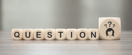 Wooden blocks with symbol of question concept