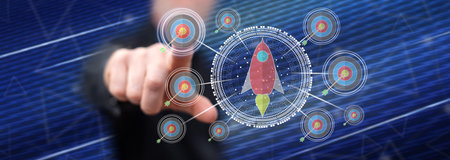 Man touching a business target concept on a touch screen with his finger