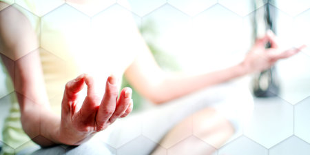 Woman practicing meditation, geometric patternの写真素材