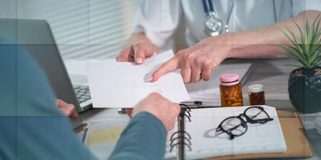 Female doctor giving prescription to her patient in medical office, geometric patternの写真素材