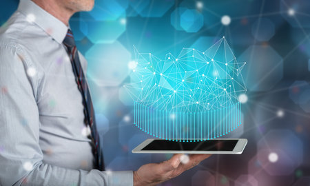 Abstract network concept above a tablet held by a man
