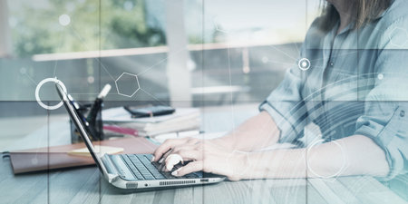 Portrait of mature businesswoman using a laptop in office, light effect, geometric pattern