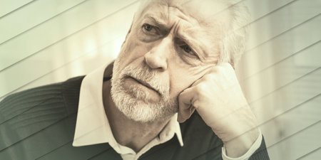Portrait of thoughtful senior businessman at office, geometric patternの写真素材