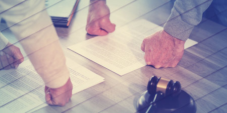 Hands of couple in conflict position during divorce. concept of divorce with judge gavel, geometric patternの写真素材