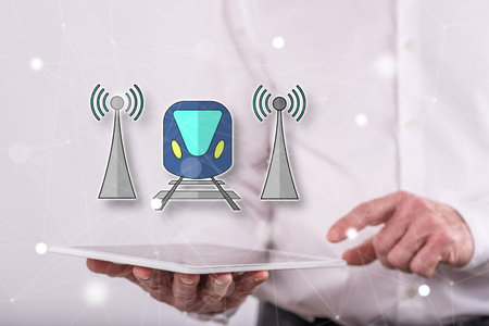Smart train concept above a tablet held by a man in backgroundの写真素材