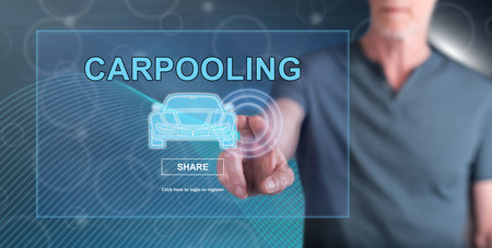 Man touching a carpooling concept on a touch screen with his fingerの写真素材