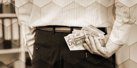 Businessman removing euro banknotes from his pocket, geometric pattern
