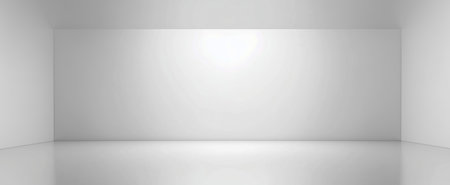 A minimalist interior featuring bright white walls and a reflective white floor ideal for presentationsの素材
