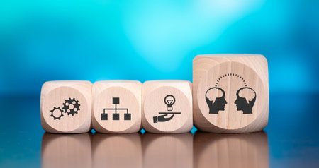 Wooden blocks with symbol of knowledge sharing concept on blue background