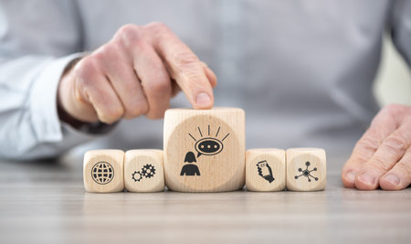 Wooden blocks with symbol of influence conceptの写真素材