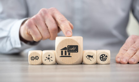 Wooden blocks with symbol of stock market conceptの写真素材