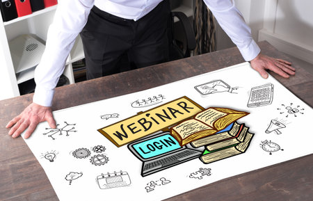 Man watching a webinar concept placed on a deskの写真素材