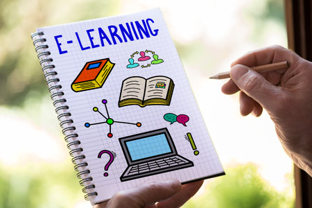 Hand drawing e-learning concept on a notepadの写真素材