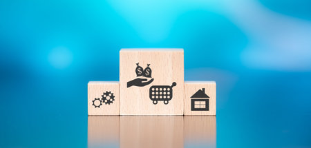Wooden blocks with symbol of personal loan concept on blue backgroundの写真素材