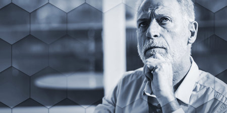 Portrait of thoughtful senior businessman, geometric patternの写真素材