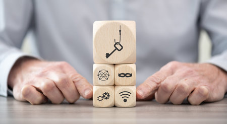 Wooden blocks with symbol of phishing conceptの写真素材