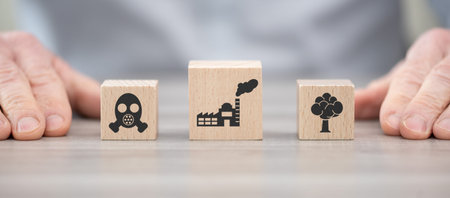 Wooden blocks with symbol of air pollution concept