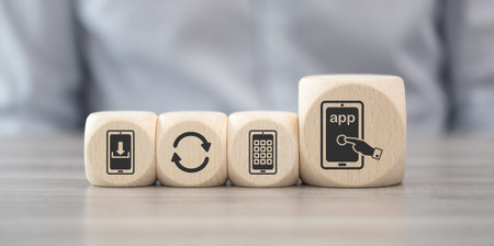 Wooden blocks with symbol of app conceptの写真素材