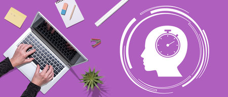 Top view of hands using laptop with symbol of time management concept