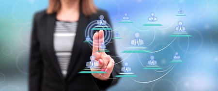 Woman touching a business social network on a touch screen with her fingersの写真素材