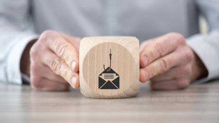 Wooden block with symbol of phishing conceptの写真素材