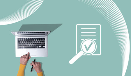 Top view of hands using laptop with symbol of assessment conceptの写真素材