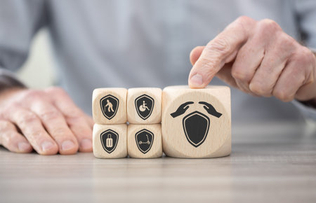 Wooden blocks with symbol of insurance concept