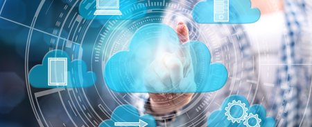 Woman touching a cloud computing concept on a touch screen with her finger