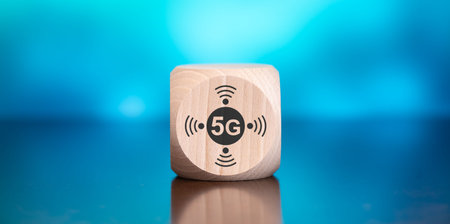 Wooden block with symbol of 5g concept on blue backgroundの写真素材