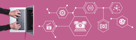 Top view of hands using laptop with symbol of video marketing conceptの写真素材