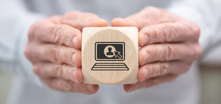 Hand holding a wooden cube with symbol of login concept