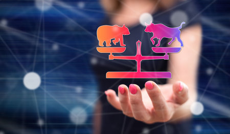 Stock market concept above the hand of a woman in backgroundの写真素材