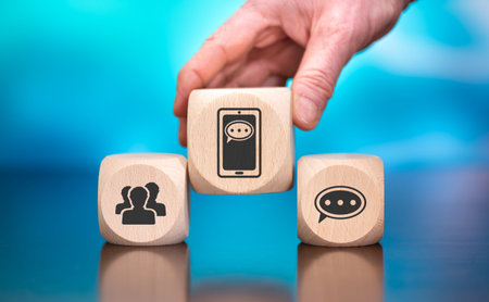 Wooden blocks with symbol of social selling concept on blue backgroundの写真素材