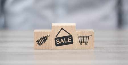 Wooden blocks with symbol of sales and discounts conceptの写真素材