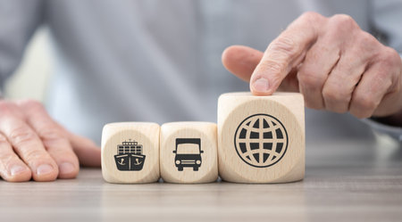 Wooden blocks with symbol of global transportation conceptの写真素材