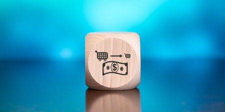 Wooden block with symbol of inflation concept on blue backgroundの写真素材