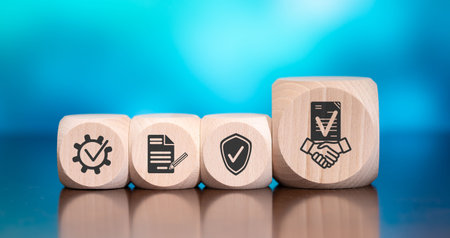 Wooden blocks with symbol of deal concept on blue backgroundの写真素材