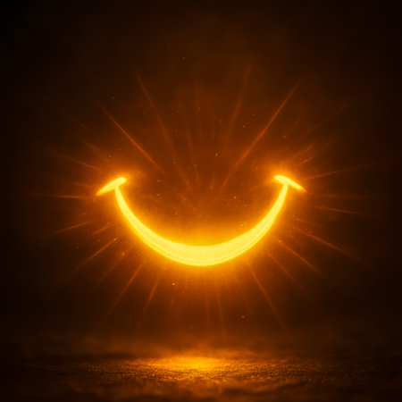 A glowing smiley face radiating golden light, creating a cheerful atmosphere in darknessの素材
