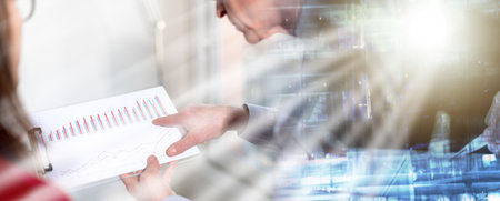 Business people in meeting discussing about financial results in office, light rays effect; multiple...