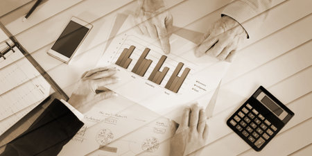 Businesspeople having a discussion about financial report at office, geometric pattern