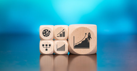 Wooden blocks with symbol of growth concept on blue background