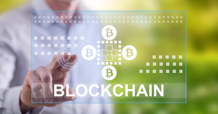 Man touching a blockchain concept on a touch screen with his finger