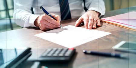 Businessman signing a document in office, geometric pattern