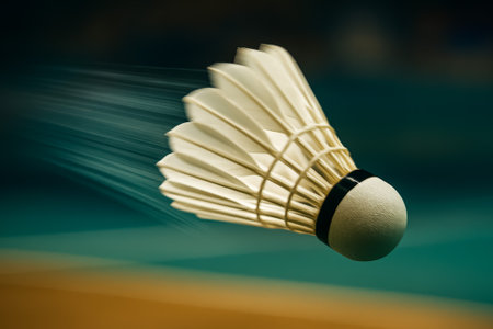 A shuttlecock captures motion as it flies through a badminton court, showing casing speedの素材
