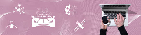 Top view of hands using laptop and mobile phone with symbol of autonomous car concept