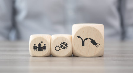 Wooden blocks with symbol of coaching conceptの写真素材