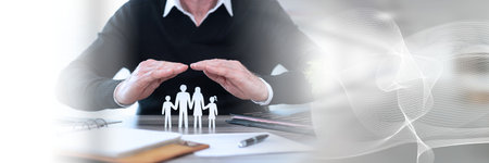 Insure protecting a family with his hands; panoramic banner