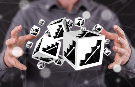 Business progress concept between hands of a man in backgroundの写真素材